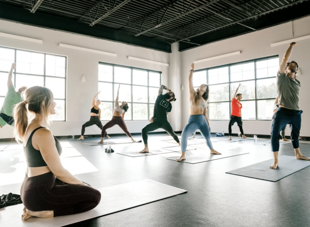 Students participate in a yoga class.